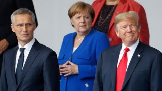 In this July 11, 2018, file photo, NATO Secretary General Jens Stoltenberg, German Chancellor Angela Merkel, US President Donald Trump, Greek Prime Minister Alexis Tsipras and other leaders gather for a family photo for the North Atlantic Treaty Organization summit at the NATO headquarters in Brussels.