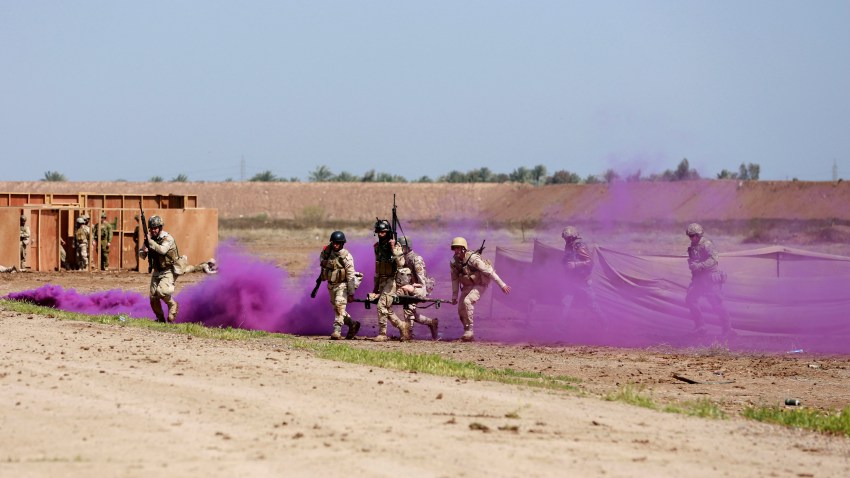 Iraqi soldiers take part in a military exercise at Camp Taji, north of Baghdad, Iraq, Monday, March 20, 2017.