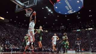 San Diego State forward Matt Mitchell (11) goes to the basket ahead of Cal Poly forward Kyle Colvin (33) during the first half of an NCAA college basketball game Saturday, Dec. 28, 2019, in San Diego.