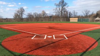 a youth baseball field sits empty at Monroeville Park in Monroeville, Pa.