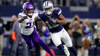 Amari Cooper #19 of the Dallas Cowboys carries the ball against Mike Hughes #21 of the Minnesota Vikings in the fourth quarter at AT&T Stadium on Nov. 10, 2019 in Arlington, Texas.