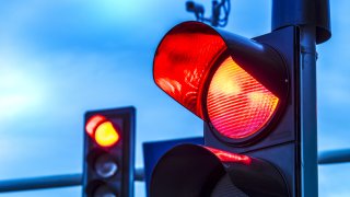 Traffic lights over urban intersection.