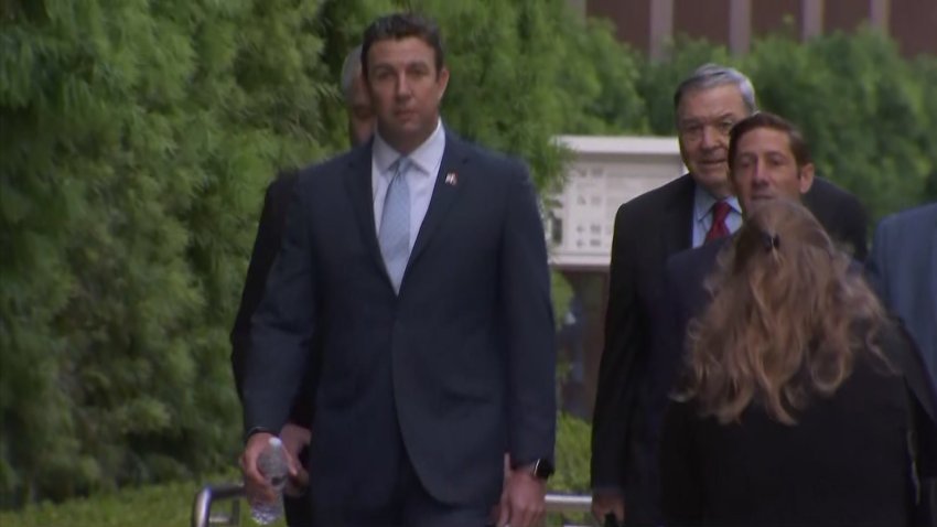 Ex-Congressman Duncan Hunter walks into court for sentencing