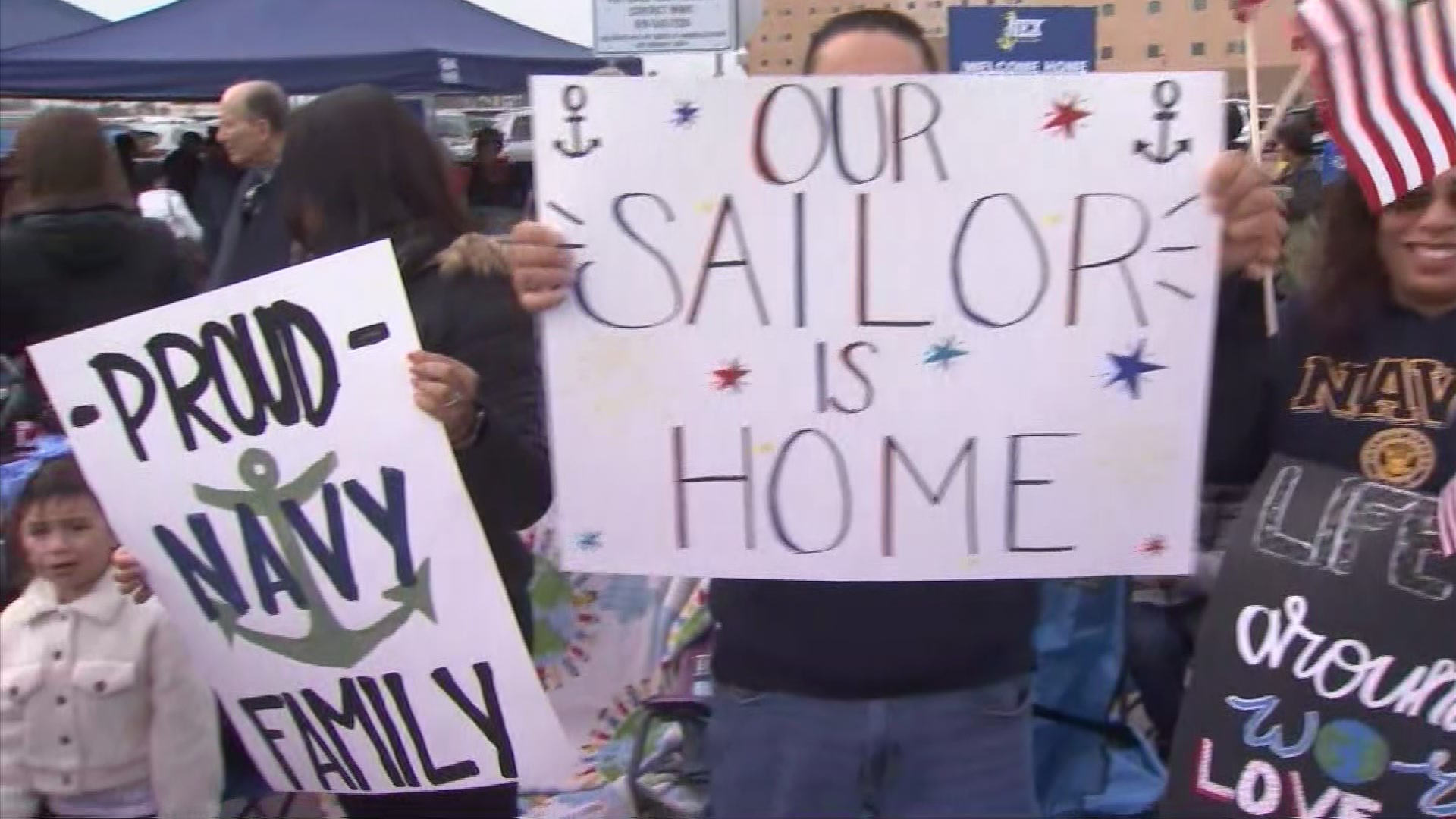 San Diegans await the return of their loved ones return from a 10-month &#8220;around the world&#8221; deployment. Family members held &#8220;welcome home signs&#8221; as upbeat music played in the background while USS Lincoln cruised into its new homeport of San Diego.