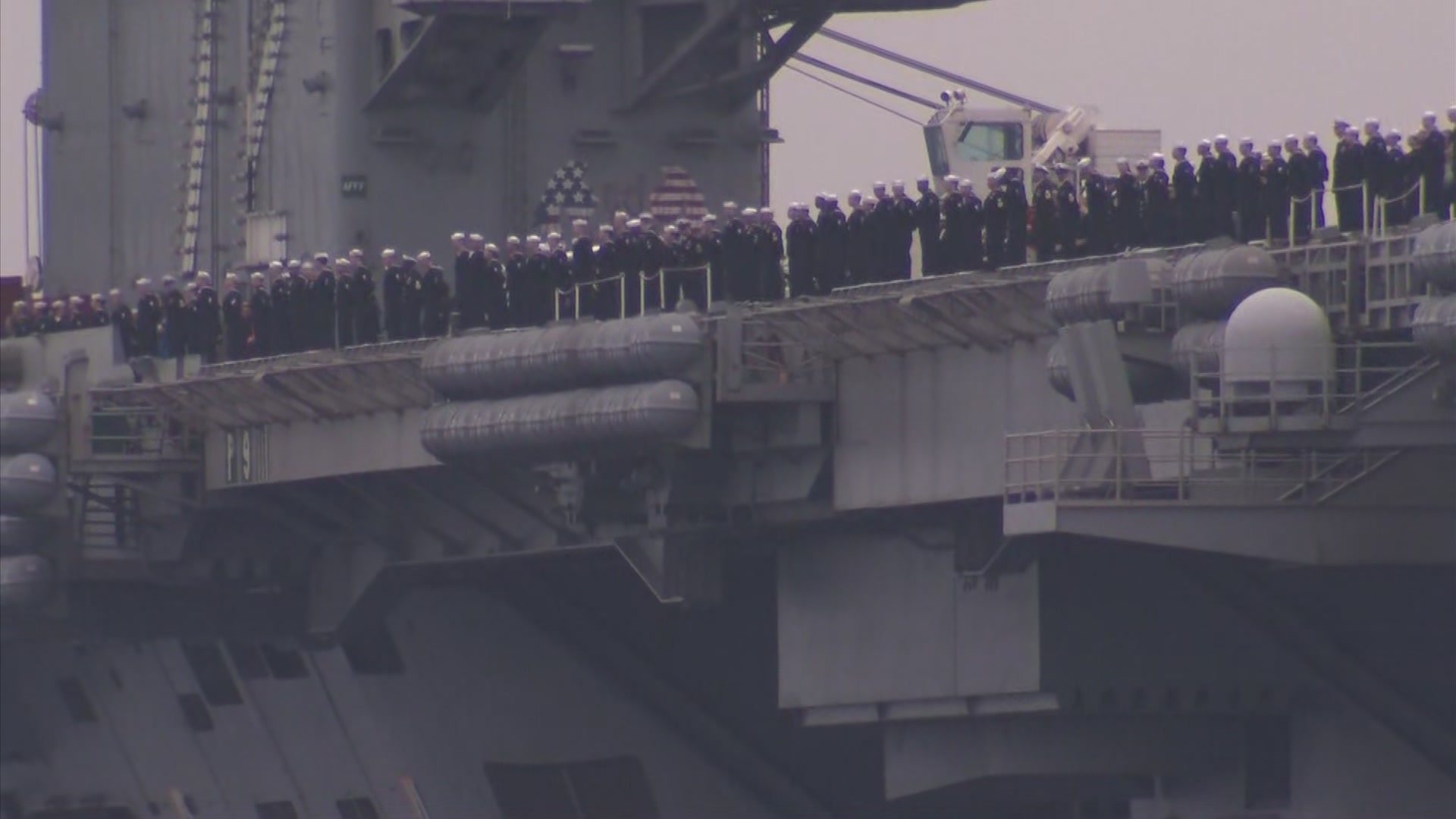 San Diegans await the return of their loved ones return from a 10-month &#8220;around the world&#8221; deployment. Family members held &#8220;welcome home signs&#8221; as upbeat music played in the background while USS Lincoln cruised into its new homeport of San Diego.