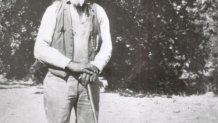 Harrison poses on his property in 1912.