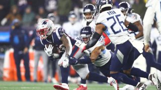 James White of the New England Patriots carries the ball against the Tennessee Titans in the AFC Wild Card Playoff game at Gillette Stadium on Jan. 4, 2020, in Foxborough, Massachusetts. The Titans won 20-13.