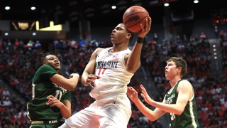 SAN DIEGO, CALIFORNIA – FEBRUARY 25: Adam Thistlewood #31 and Dischon Thomas #11 of the Colorado State Rams defend against a shot by Matt Mitchell #11 of the San Diego State Aztecs during the first half of a game at Viejas Arena on February 25, 2020 in San Diego, California. (Photo by Sean M. Haffey/Getty Images)