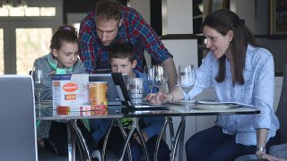 The Goldwasser family, Matthew, JulieSue, Ari, 9, Alison, 7, have a Zoom rehearsal for their seder which they will be having virtually with other families at the Rashi School in Needham, MA on Apr. 7, 2020.