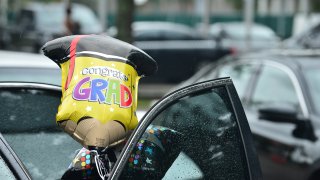 a mylar balloon tied to a vehicle