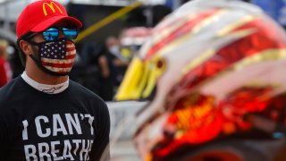 In this June 7, 2020, file photo, Bubba Wallace wears an "I Can't Breath - Black Lives Matter" T-shirt under his fire suit prior to the NASCAR Cup Series Folds of Honor QuikTrip 500 at Atlanta Motor Speedway in Hampton, Georgia.