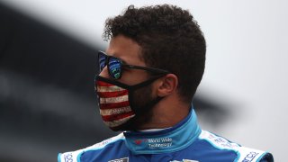Bubba Wallace walks the grid prior to the NASCAR Cup Series Big Machine Hand Sanitizer 400 Powered by Big Machine Records at Indianapolis Motor Speedway on July 5, 2020, in Indianapolis.
