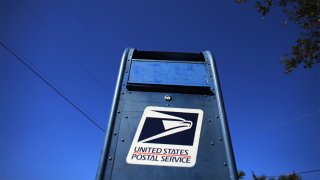 MIAMI, FL – NOVEMBER 15: A U.S. Postal Service mailbox stands on November 15, 2012 in Miami, Florida.(Photo by Joe Raedle/Getty Images)