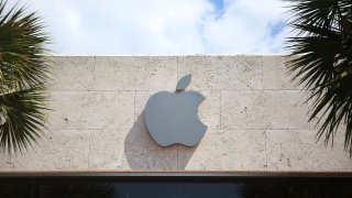 An Apple sign is seen outside of a store on April 26, 2016 in Miami Beach, Florida.