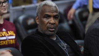 In this file photo, former NBA player Charles Oakley sits court side prior to the game between the Cleveland Cavaliers and the New York Knicks at Quicken Loans Arena on February 15, 2017 in Cleveland, Ohio.