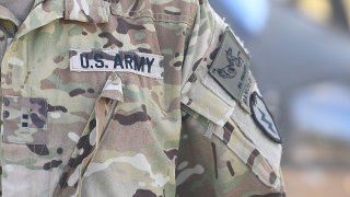 In this July 12, 2017, file photo, the sleeve insignia and uniform of an American soldier is seen at the Williamson airfield in the Shoalwater Bay Training Area as part of Battle Group Pegasus in Rockhampton, Australia.
