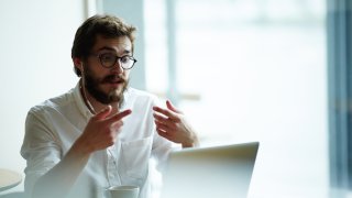 File photo: Young specialist communicating with employer through video-chat