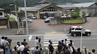 In this July 26, 2016, file photo, journalists gather in front of Tsukui Yamayuri-en, a facility for the handicapped where a former care home employee killed disabled people, in Sagamihara, outside Tokyo. The Yokohama District Court sentenced Satoshi Uematsu, 30, to death Monday, March 16, 2020, for killing 19 disabled people and injuring 24 others four years ago in the deadliest mass attack in postwar Japan.