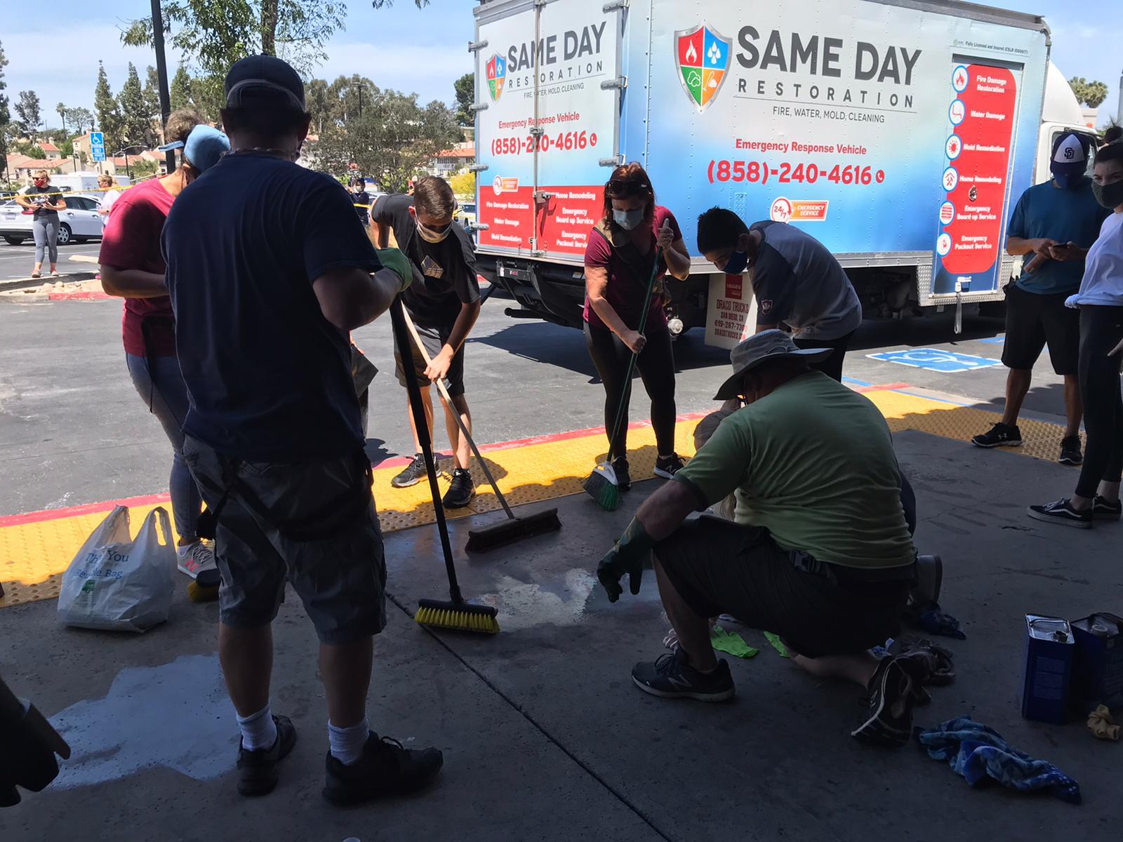 Community members come together to clean up the aftermath of the protests.