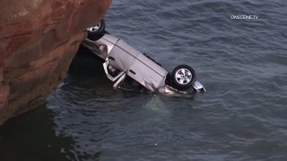 A man and his two young daughters were rescued after he intentionally drove off Sunset Cliffs.