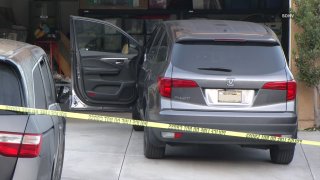 Photo of the two cars that pinned the man