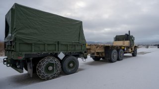 A U.S. Marine Corps Medium Tactical Vehicle Replacement from the MCPP-N caves sits staged at Vӕrnes Garnison, Norway.