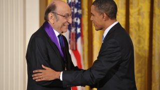 In this Feb. 25, 2010, file photo, U.S. President Barack Obama shakes hands with graphic designer Milton Glaser after presenting him with the 2009 National Medal of Arts during a ceremony in the East Room of the White House in Washington, DC.