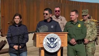 Acting Department of Homeland Security Chad Wolf speaks in front of the southern border wall.