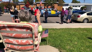 Ruth Gallivan, 104, waves to the crowd who surprised her with a "drive by" birthday party.