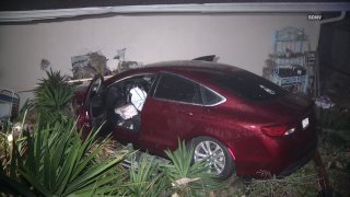 Red car slams into Rancho Bernardo home