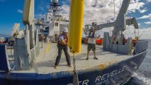 Deploying a Wirewalker from the stern of Scripps Oceanography research vessel