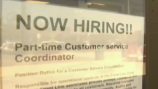 A "Now Hiring" sign