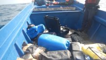 Members of the Coast Guard Cutter Active (WMEC-618) boarding team inspect a suspected smuggling vessel containing more than 2,000 pounds of cocaine in international waters of the Eastern Pacific Ocean in May 2020.
