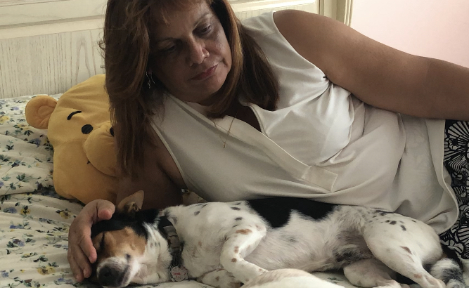 María Burgos finds comfort in her dogs. She says being with them helps her canalize all the stress.