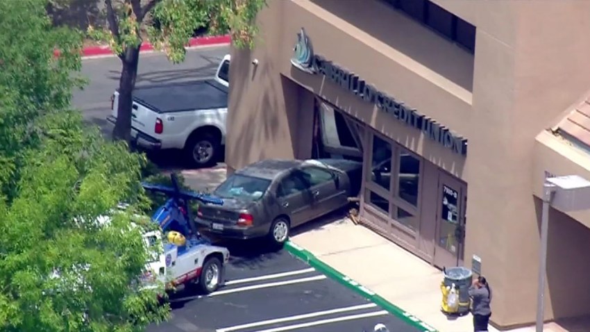 car into building la mesa credit union