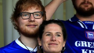 In this April 21, 2018, file photo, musician Ed Sheeran and Cherry Seaborn look on during the Sky Bet Championship match between Ipswich Town and Aston Villa at Portman Road in Ipswich, England.