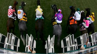 FILE Horses coming out of the gate at the Del Mar Racing track in 2019.