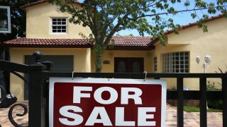 A for sale sign is seen in front of a home on August 21, 2015 in Miami, Florida.