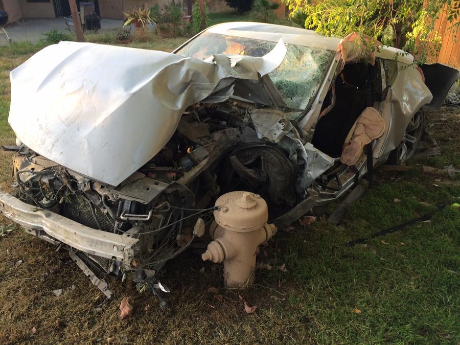 A neighbor snapped these pictures of the car after the crash on Wednesday