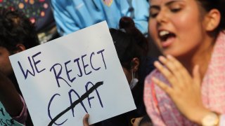 Students and activists hold placards and shout slogans during a protest against Citizenship Amendment Act (CAA) in Mumbai, India on Dec. 16, 2019.
