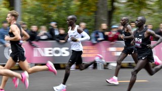 Kenya's Eliud Kipchoge (white jersey) runs during his attempt to bust the mythical two-hour barrier for the marathon on October 12 2019 in Vienna. - Kipchoge holds the men's world record for the distance with a time of 2hr 01min 39sec, which he set in the flat Berlin marathon on September 16, 2018. He tried in May 2017 to break the two-hour barrier, running on the Monza National Autodrome racing circuit in Italy, failing narrowly in 2hr 00min 25sec.