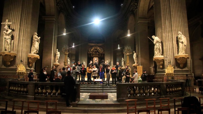 In this photo taken Monday, Dec. 16, 2019, members of the Notre Dame cathedral choir rehearse at the Saint Sulpice church in Paris. Notre Dame Cathedral kept holding services during two world wars as a beacon of hope amid bloodshed and fear. It took a fire in peacetime to finally stop Notre Dame from celebrating Christmas Mass for the first time in more than two centuries.