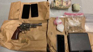 A gun, drugs, and cash were seized by police