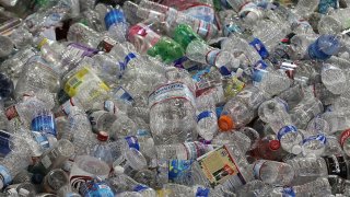 Hundreds of plastic bottles in a pile.