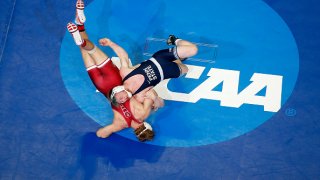 Bo Nickal of the Penn State Nittany Lions attempts a body slam of Nathan Traxler of the Stanford Cardinal in the 197 lbs weight class quarterfinals during the Division I Men's Wrestling Championship