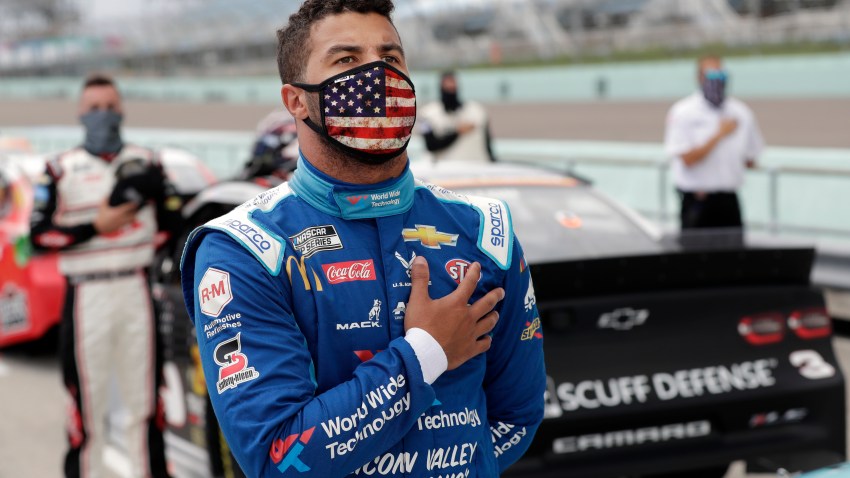 Jun 14, 2020; Homestead, Florida, USA; Driver Bubba Wallace stands for the national anthem prior to the NASCAR Cup series race at Homestead-Miami Speedway. Mandatory Credit: Wilfredo Lee/Pool Photo via USA TODAY Network