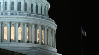 In this file photo, lights are on at the US Capitol as the House of Representatives works during a rare Sunday session on March 21, 2010 in Washington, DC.