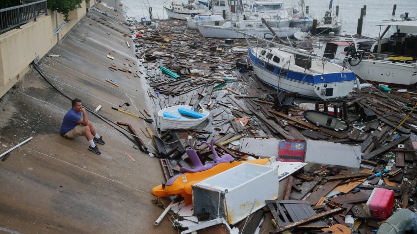 Allen Heath surveys the damage to a private marina after it was hit by Hurricane Hanna, Sunday, July 26, 2020, in Corpus Christi, Texas