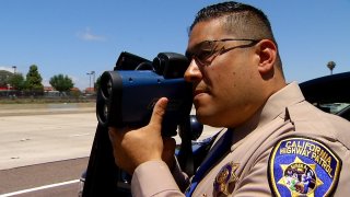 CHP Officer with speeding gun on State Route 163 in San Diego