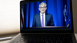 Jerome Powell, chairman of the U.S. Federal Reserve, speaks during a virtual news conference seen on a laptop computer in Arlington, Virginia, U.S., on Wednesday, July 29, 2020. Federal Reserve officials left their benchmark interest rate unchanged near zero and again vowed to use all their tools to support the U.S. economy amid a shaky recovery from the coronavirus pandemic.